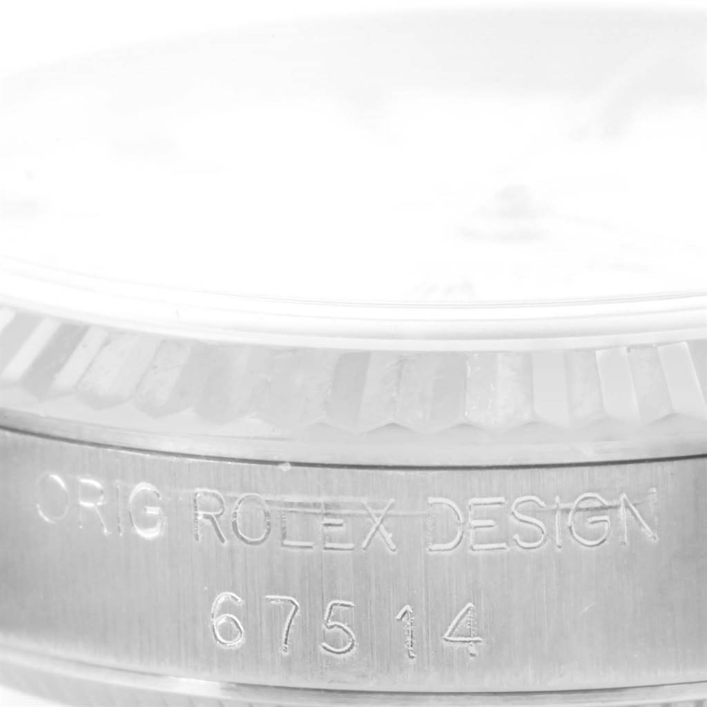 This image shows a close-up of the inscription on the side of the bezel of a Rolex Datejust 67514 Women's Stainless Steel White Dial 67514 Women's Stainless Steel White Dial watch.