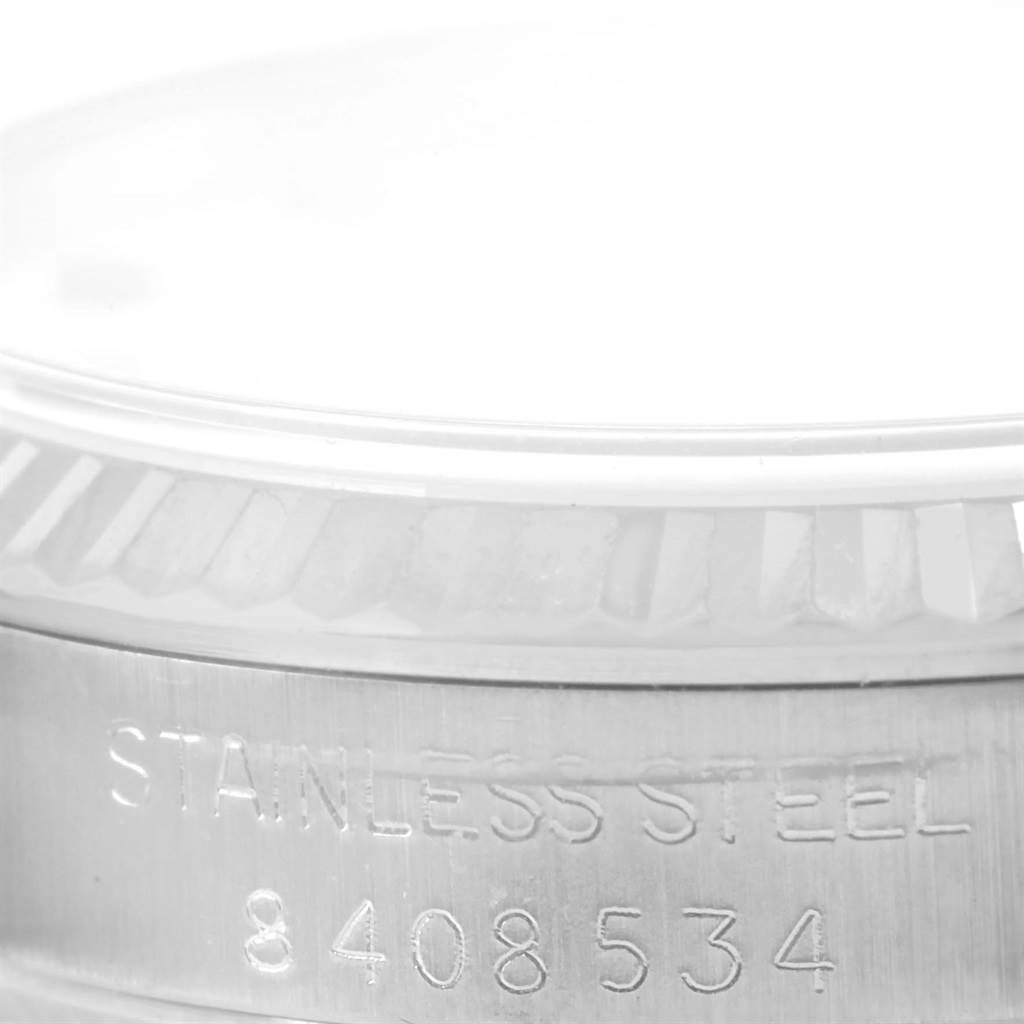 The image shows a close-up side view of the stainless steel case with the serial number inscribed on a Rolex Datejust 67514 Women's Stainless Steel White Dial 67514 Women's Stainless Steel White Dial watch.