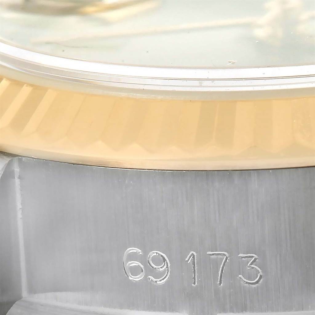 This image shows a close-up of the bezel and part of the case with the reference number on a Rolex Datejust 69173 Women's Stainless Steel Grey Dial 69173 Women's Stainless Steel Grey Dial watch.
