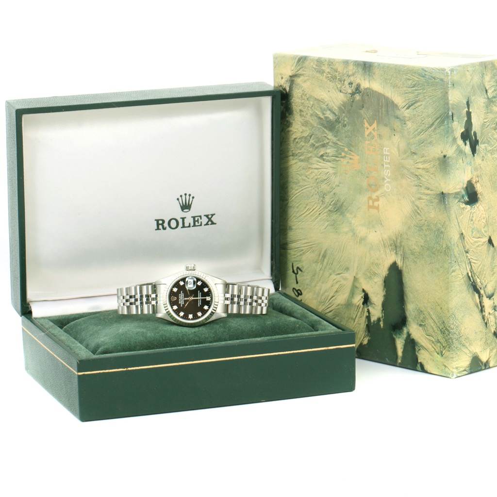 The image shows a Rolex 69174 Men
s Stainless Steel Black Dial 69174 Men
s Stainless Steel Black Dial Datejust Ladies Steel White Gold Diamond Watch 69174 Box model in its open green box with packaging.