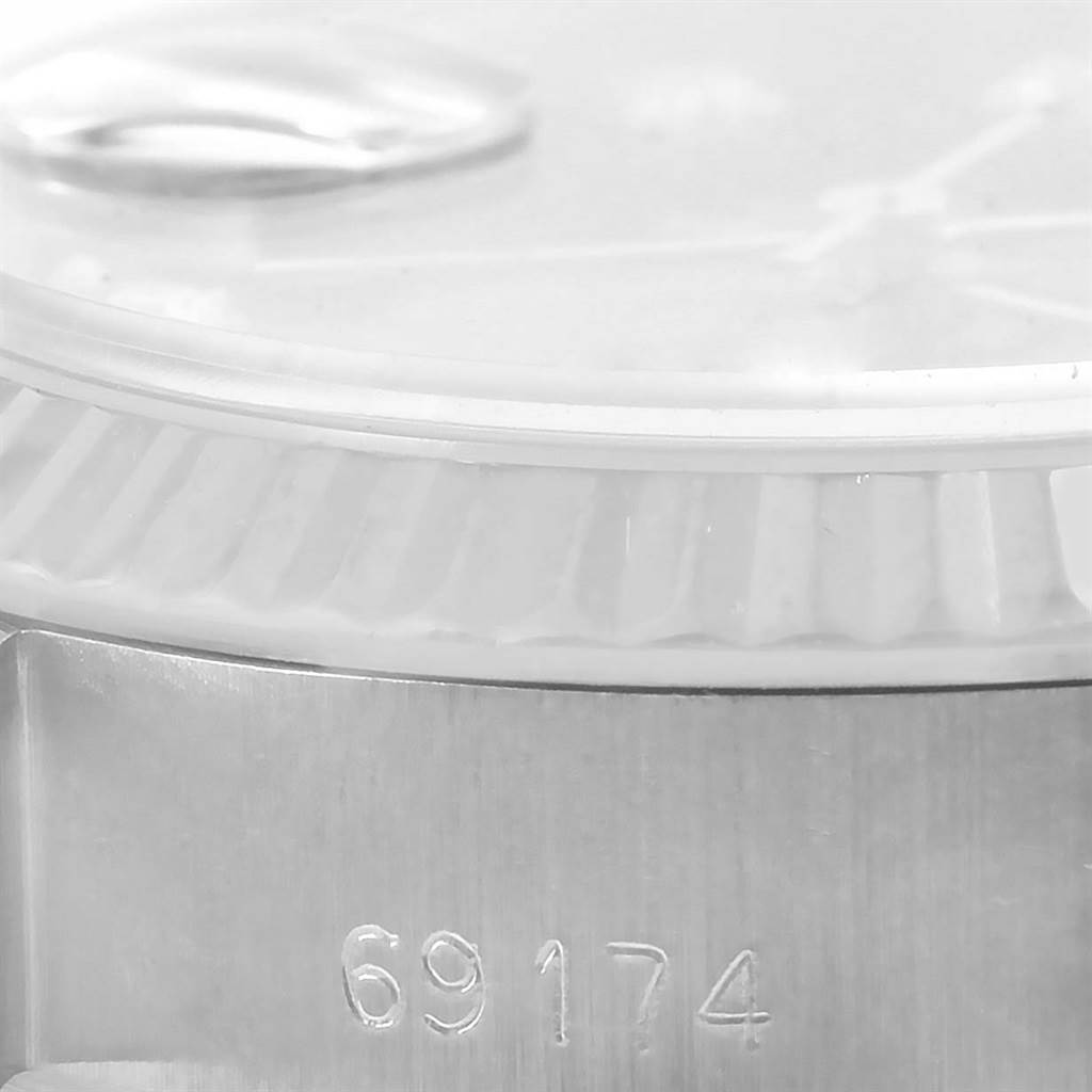 This image shows a close-up side view of the Rolex 69174 Men
s Stainless Steel Black Dial 69174 Men
s Stainless Steel Black Dial Datejust Ladies Steel White Gold Diamond Watch 69174 model, focusing on the case and bezel.