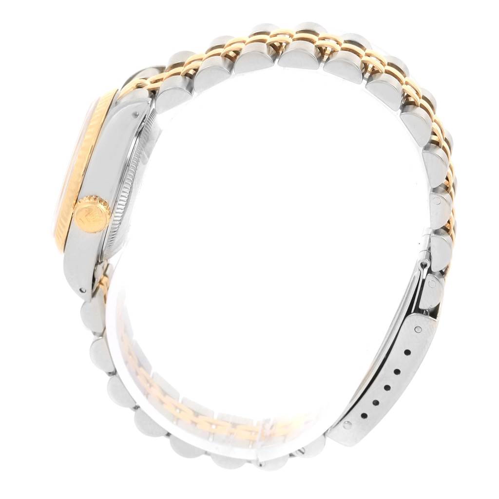 The image shows a side view of a Rolex Datejust 69173 Women
s Stainless Steel Champagne Dial 69173 Women
s Stainless Steel Champagne Dial watch, focusing on the case, crown, and two-tone metal bracelet.