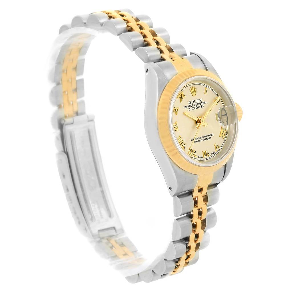 The Rolex Datejust 69173 Women
s Stainless Steel Champagne Dial 69173 Women
s Stainless Steel Champagne Dial watch is shown at a slight side angle highlighting the two-tone bracelet, bezel, and dial.