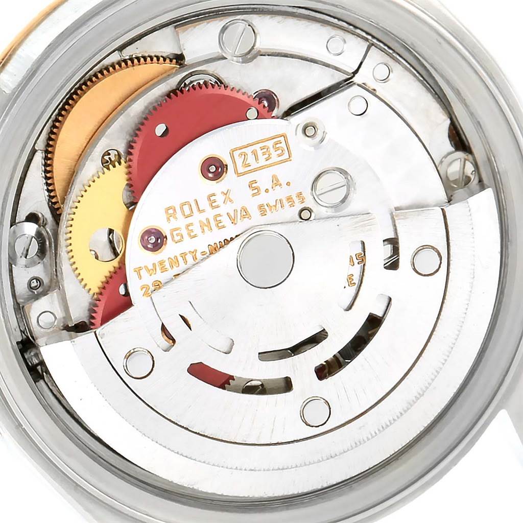 The image shows the internal mechanical movement parts of a Rolex Datejust 69173 Women
s Stainless Steel Champagne Dial 69173 Women
s Stainless Steel Champagne Dial watch, highlighting gears and the winding rotor.
