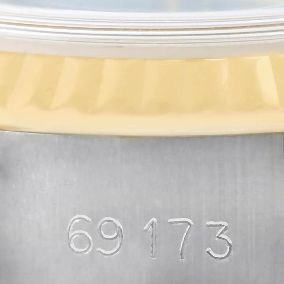 The image shows a close-up of the model number engraving and part of the bezel of a Rolex Datejust 69173 Women's Stainless Steel Black Dial 69173 Women's Stainless Steel Black Dial watch.