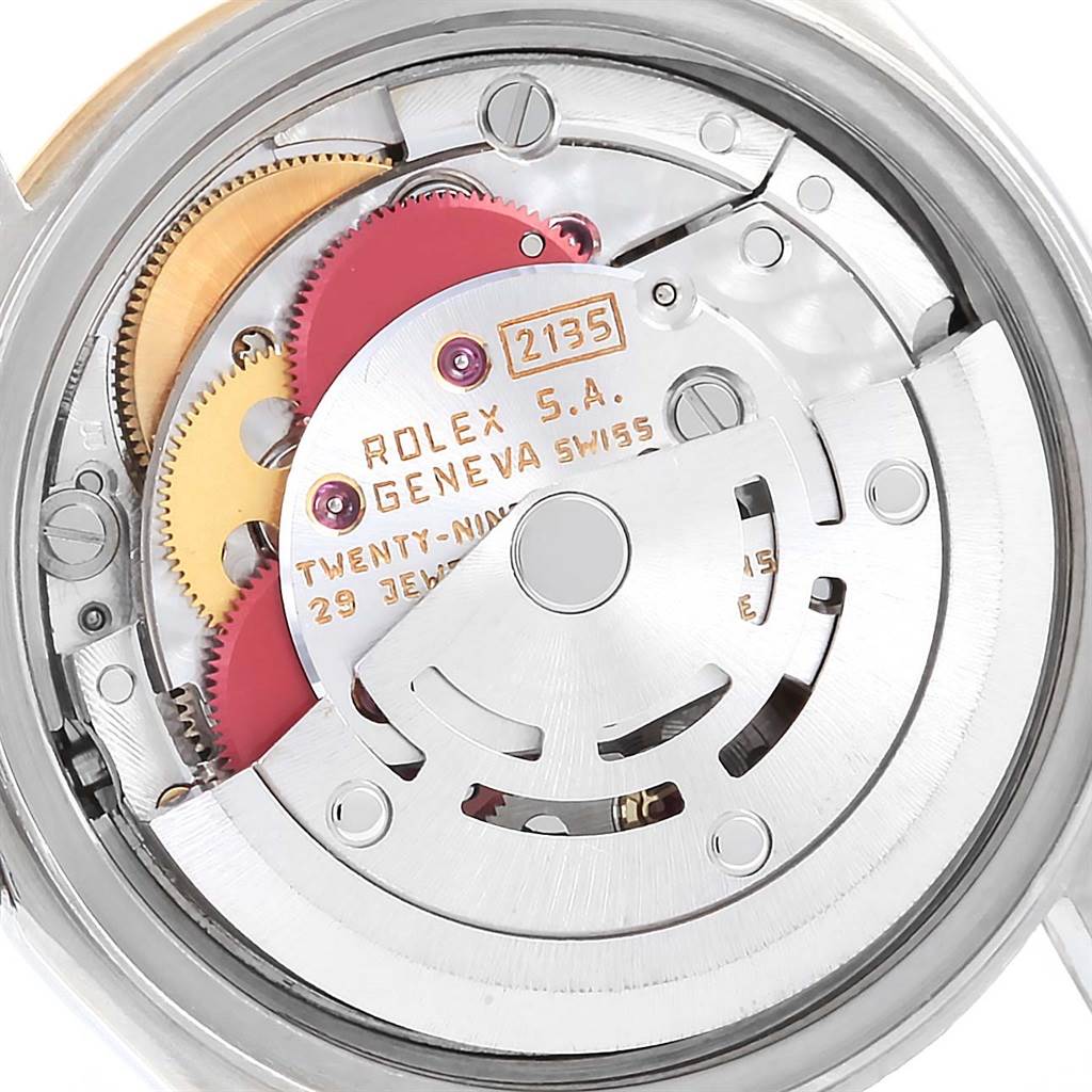 This image shows a close-up of the movement inside a Rolex Datejust 69173 Women's Stainless Steel Black Dial 69173 Women's Stainless Steel Black Dial watch, focusing on the gears and rotor.