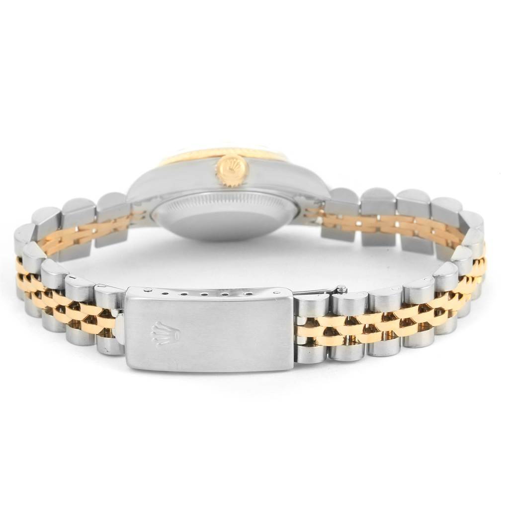 The image shows the back view of a Rolex Datejust 69173 Women
s Stainless Steel Grey Dial 69173 Women
s Stainless Steel Grey Dial watch, highlighting its case back and bi-color bracelet with clasp.