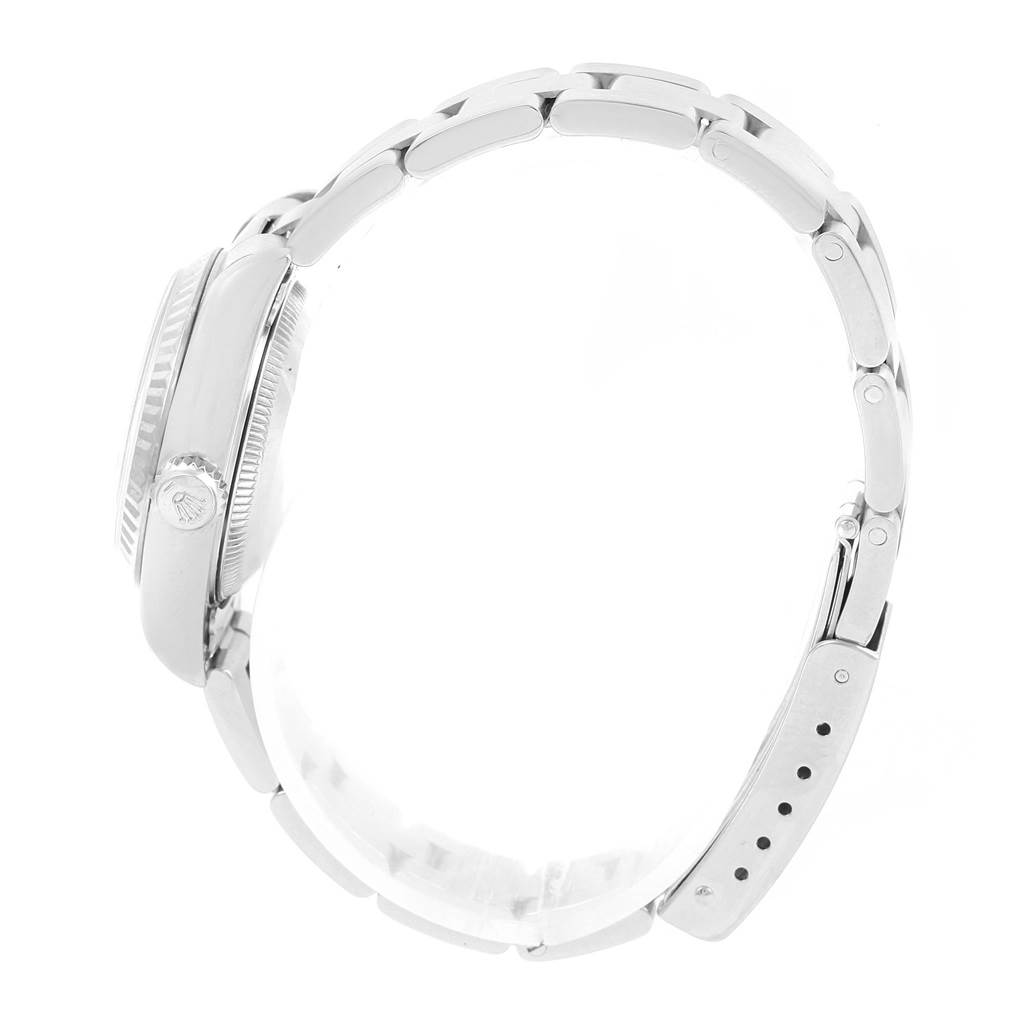 The image shows the right side profile of a Rolex Datejust 79174 Women's Stainless Steel Mother of Pearl Dial 79174 Women's Stainless Steel Mother of Pearl Dial watch, highlighting the crown and bracelet with clasp.