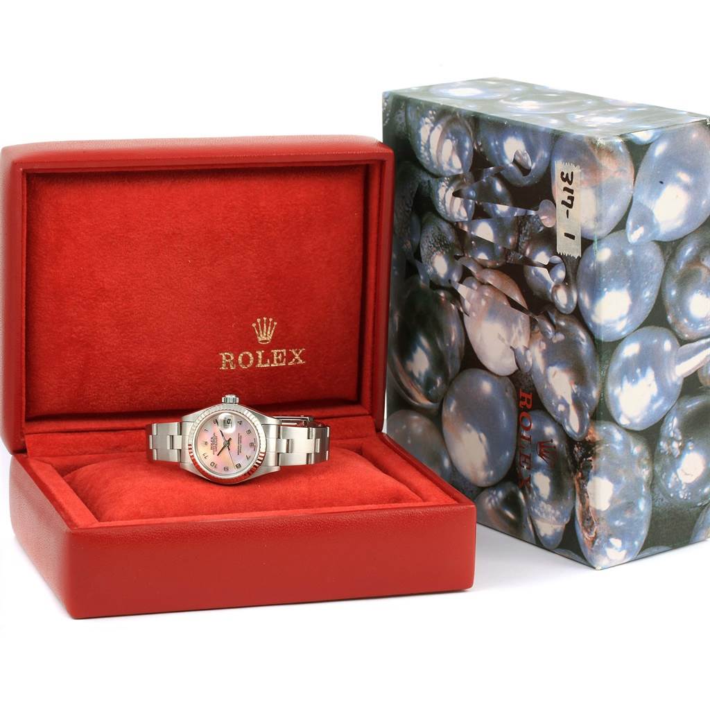 This image shows a Rolex Datejust 79174 Women's Stainless Steel Mother of Pearl Dial 79174 Women's Stainless Steel Mother of Pearl Dial watch in its red presentation box with a decorative outer box beside it.