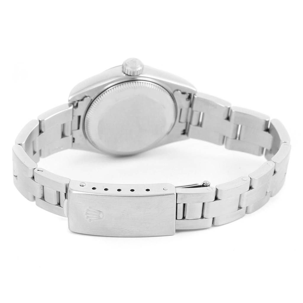 The image shows the rear view of a Rolex Datejust 79174 Women's Stainless Steel Mother of Pearl Dial 79174 Women's Stainless Steel Mother of Pearl Dial watch, highlighting its case back, crown, and bracelet with the clasp visible.