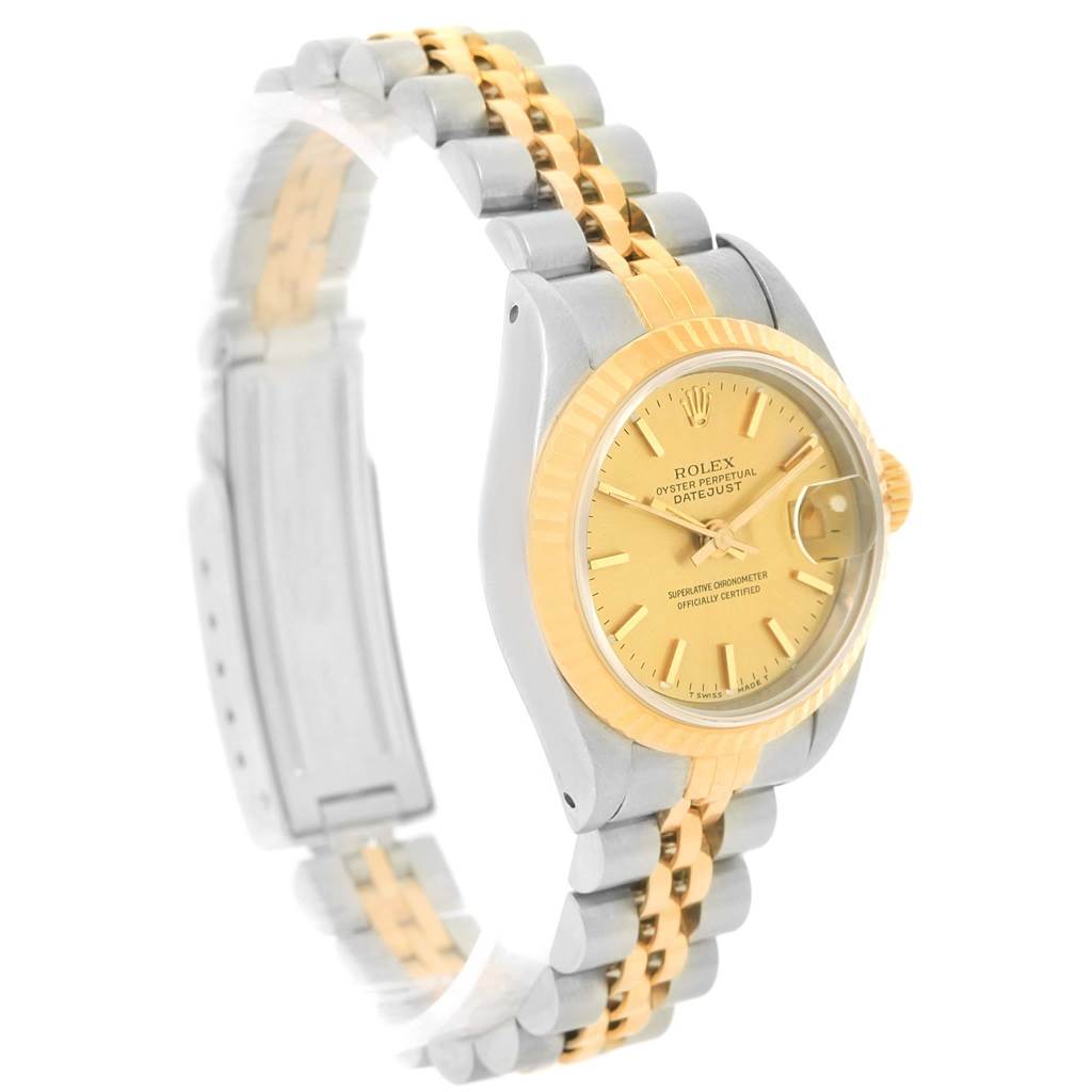 This image shows a side angle view of a Rolex Datejust 69173 Women's Stainless Steel Champagne Dial 69173 Women's Stainless Steel Champagne Dial watch, highlighting the two-tone bracelet and gold bezel.