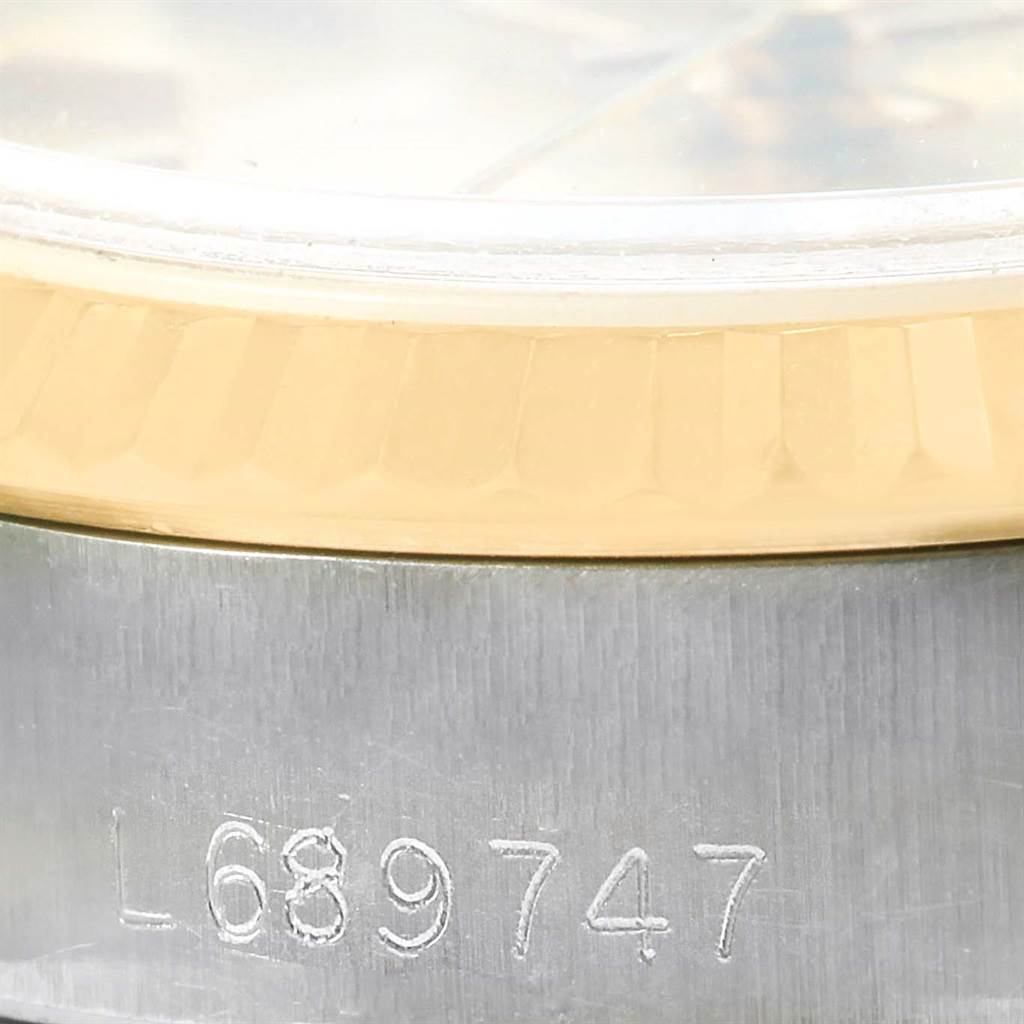 The image shows a close-up of the model number and part of the fluted bezel on a Rolex Datejust 69173 Women's Stainless Steel Champagne Dial 69173 Women's Stainless Steel Champagne Dial watch.