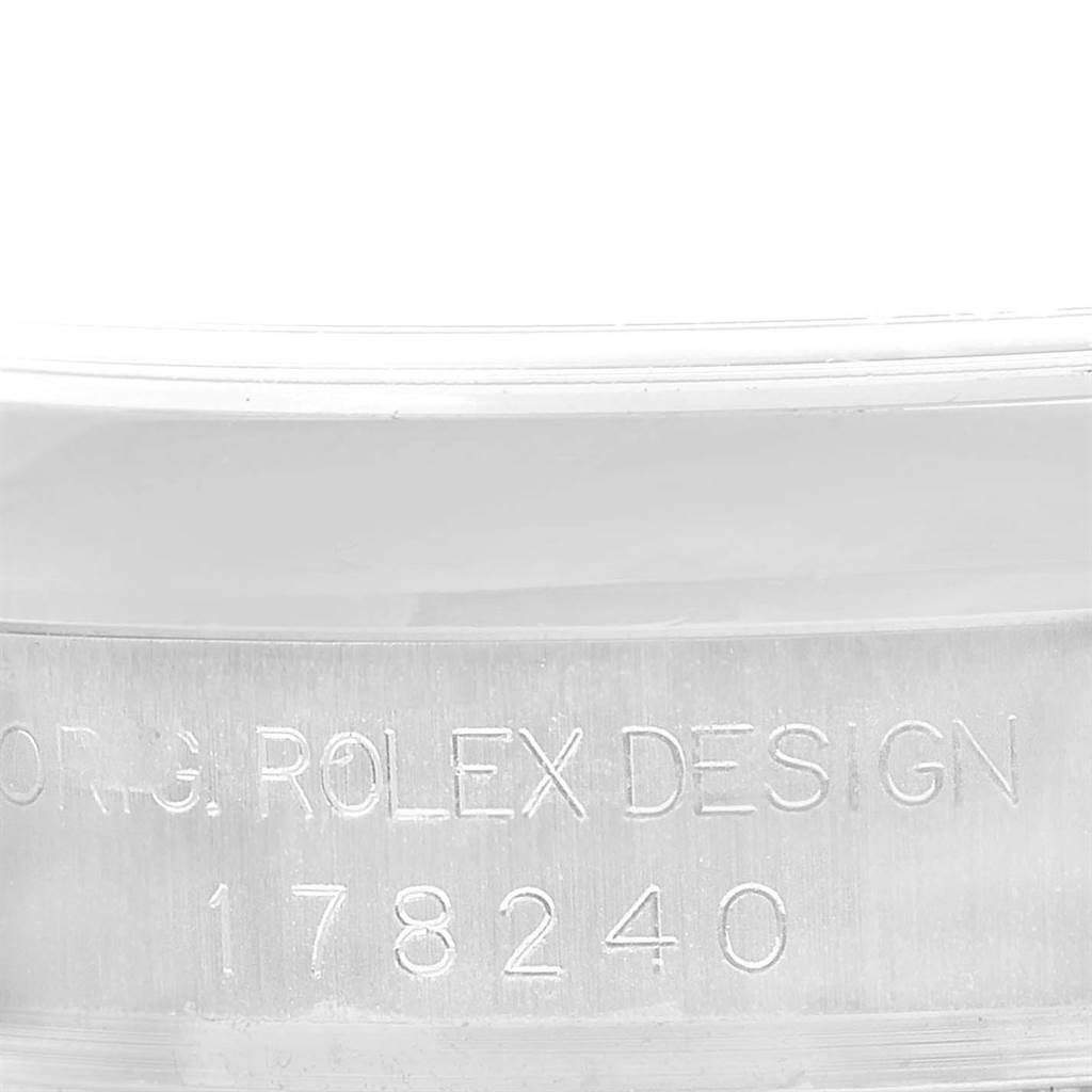 This image shows an angled close-up of the case engraving on a Rolex Datejust 178240 Women
s Stainless Steel Pink Dial 178240 Women
s Stainless Steel Pink Dial model.