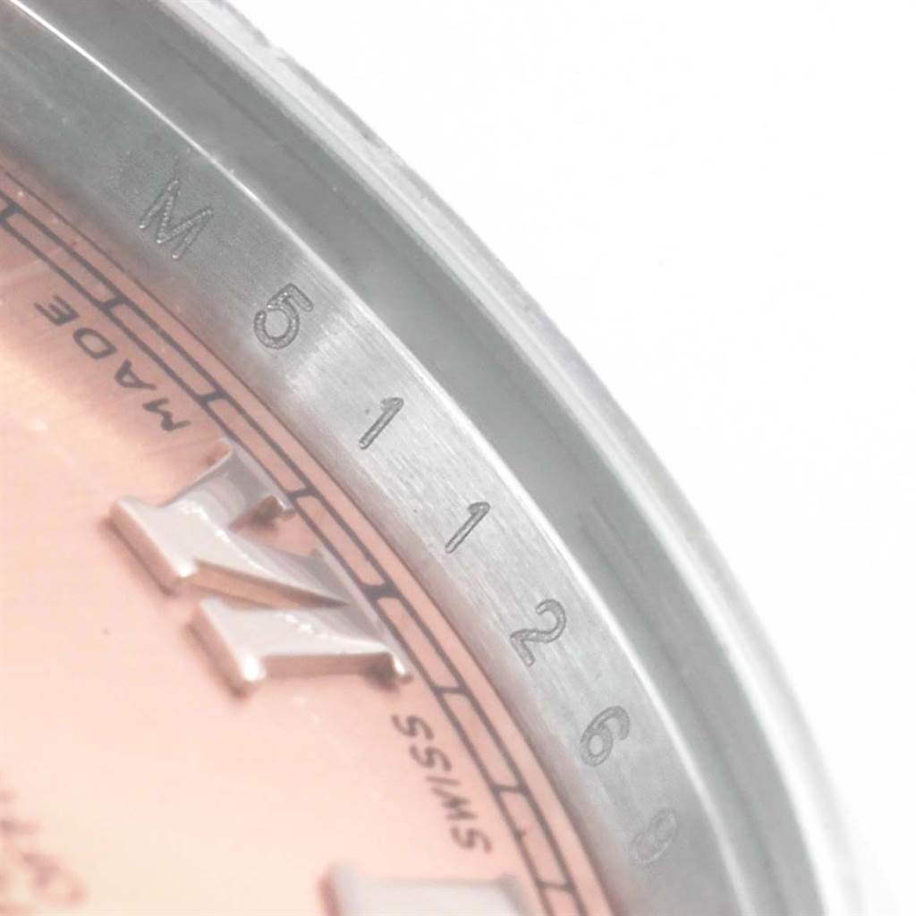 Close-up of the dial and rehaut (engraved inner bezel) of a Rolex Datejust 178240 Women
s Stainless Steel Pink Dial 178240 Women
s Stainless Steel Pink Dial watch.