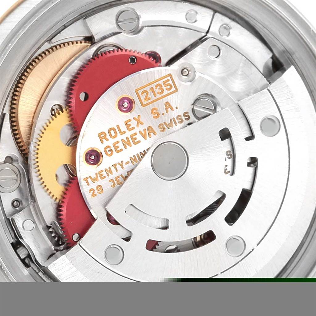 This image shows the internal mechanical movement parts of the Rolex Datejust 69173 Women's Stainless Steel White Dial 69173 Women's Stainless Steel White Dial watch, including gears and the rotor.