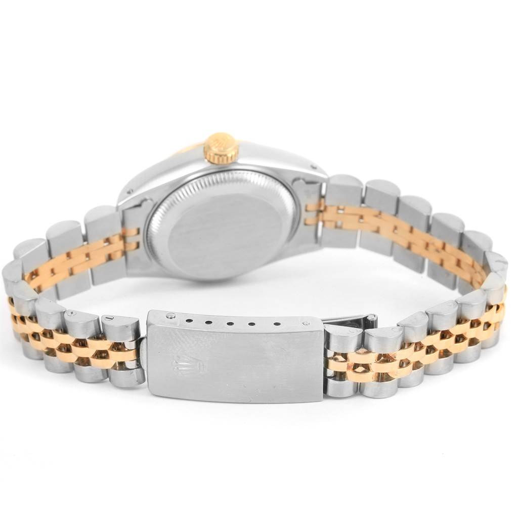 The image shows the back view of a Rolex Datejust 69173 Women
s Stainless Steel Champagne Dial 69173 Women
s Stainless Steel Champagne Dial watch, highlighting its two-tone bracelet and closed clasp.