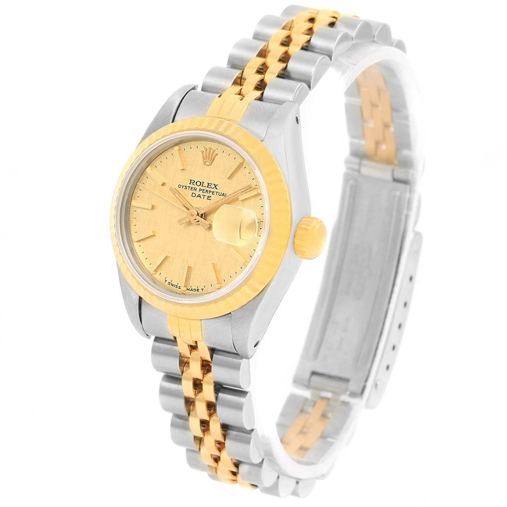 The Rolex Datejust 69173 Women
s Stainless Steel Champagne Dial 69173 Women
s Stainless Steel Champagne Dial watch is shown at a slight angle, highlighting its gold and silver case, bezel, bracelet, and dial with a date feature.