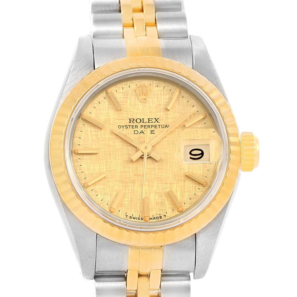The image shows a front view of a Rolex Datejust 69173 Women
s Stainless Steel Champagne Dial 69173 Women
s Stainless Steel Champagne Dial watch, featuring a gold dial, bezel, and a two-tone metal bracelet.