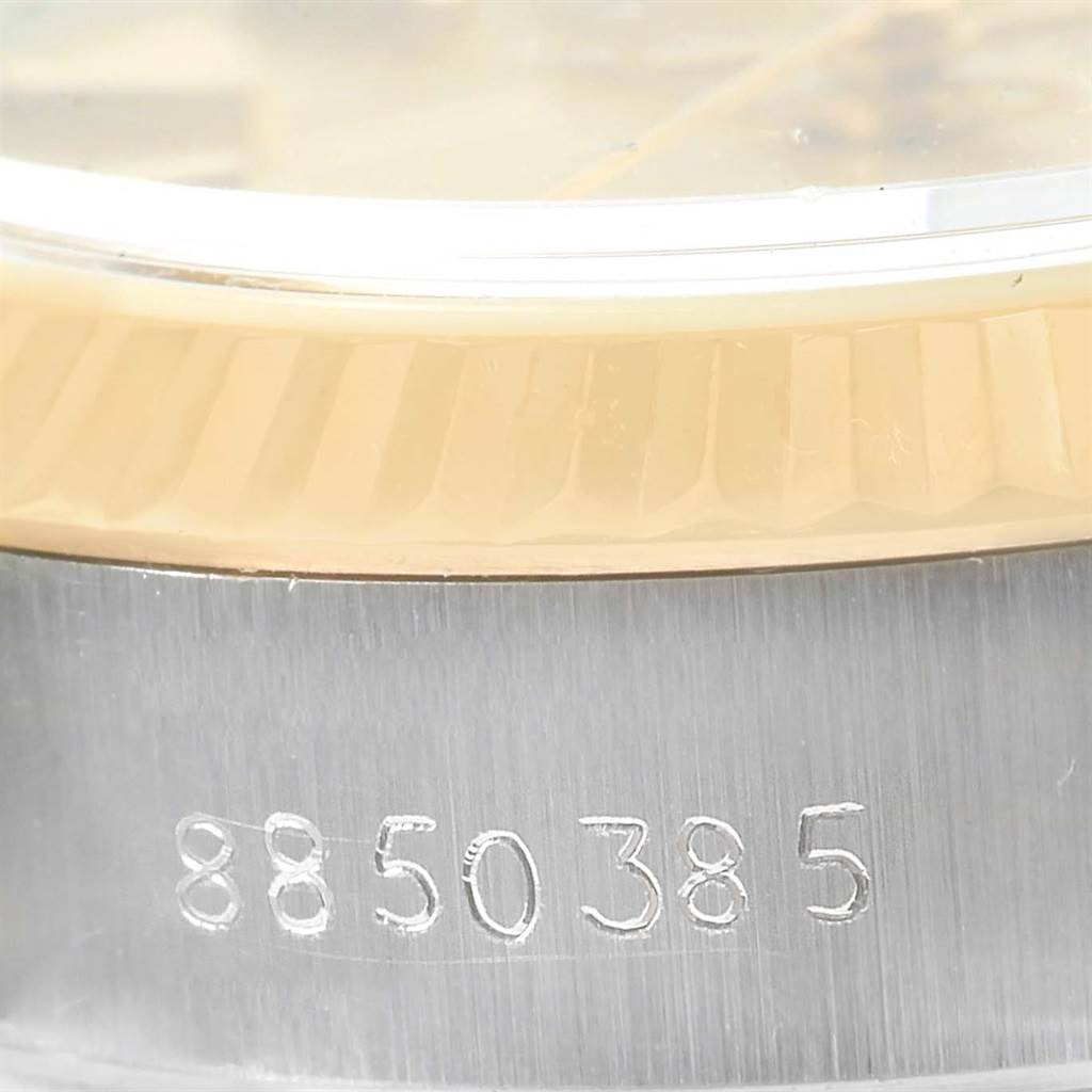 This image shows a close-up of the serial number engraved on the case edge of a Rolex Datejust 69173 Women
s Stainless Steel Champagne Dial 69173 Women
s Stainless Steel Champagne Dial watch.