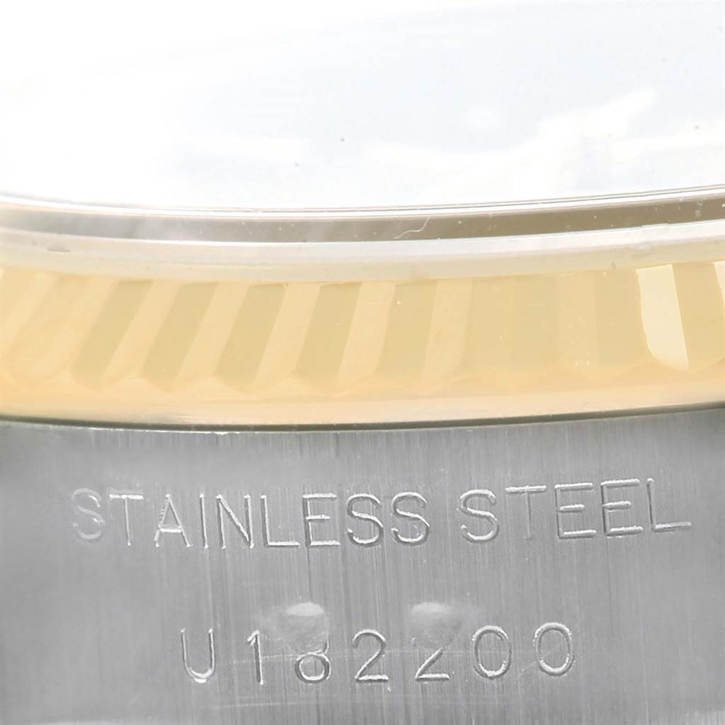 This image shows a close-up of the stainless steel case back with part of the bezel of a Rolex Datejust 69173 Women
s Stainless Steel Champagne Dial 69173 Women
s Stainless Steel Champagne Dial model watch.