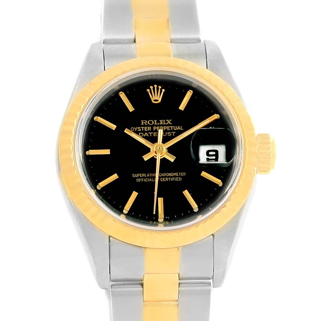 The image shows a front view of a Rolex Datejust 69173 Women
s Stainless Steel Black Dial 69173 Women
s Stainless Steel Black Dial watch with a black dial, gold accents, and a two-tone bracelet.