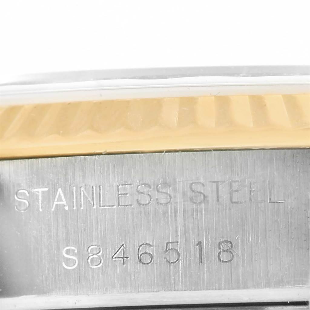 The image shows a close-up of the serial number and "Stainless Steel" engraving on the case of a Rolex Datejust 69173 Women's Stainless Steel Black Dial 69173 Women's Stainless Steel Black Dial.