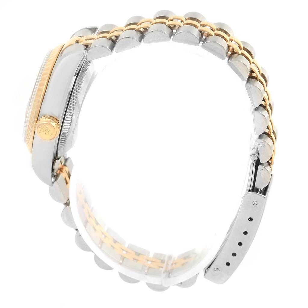 The image shows a side view of a Rolex Datejust 69173 Women's Stainless Steel Black Dial 69173 Women's Stainless Steel Black Dial watch highlighting the crown, case, and two-tone jubilee bracelet.