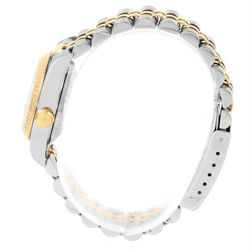 The image shows a side view of the Rolex Datejust 79173 Women
s Stainless Steel Silver Dial 79173 Women
s Stainless Steel Silver Dial watch, highlighting the case, crown, and two-tone bracelet.