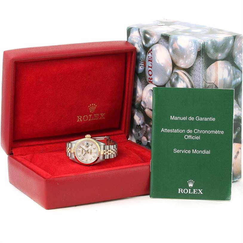 The Rolex Datejust 79173 Women
s Stainless Steel Silver Dial 79173 Women
s Stainless Steel Silver Dial watch is displayed inside an open red box, accompanied by a green manual booklet on the right.