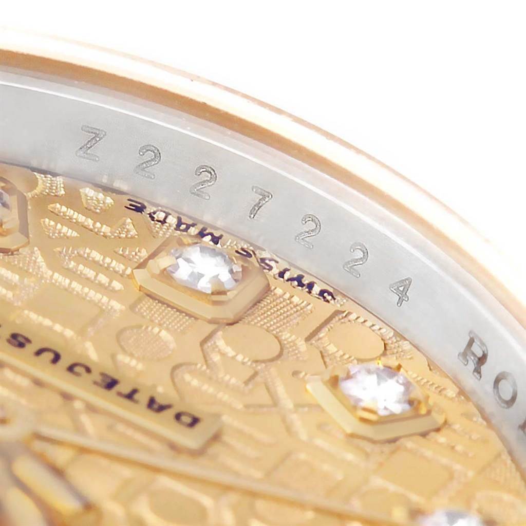 The image shows a close-up of the Rolex Datejust 179163 Women's Steel and Gold (two tone) Champagne Dial 179163 Women's Steel and Gold (two tone) Champagne Dial dial, showcasing part of the face, diamonds, and the serial number on the inner bezel.