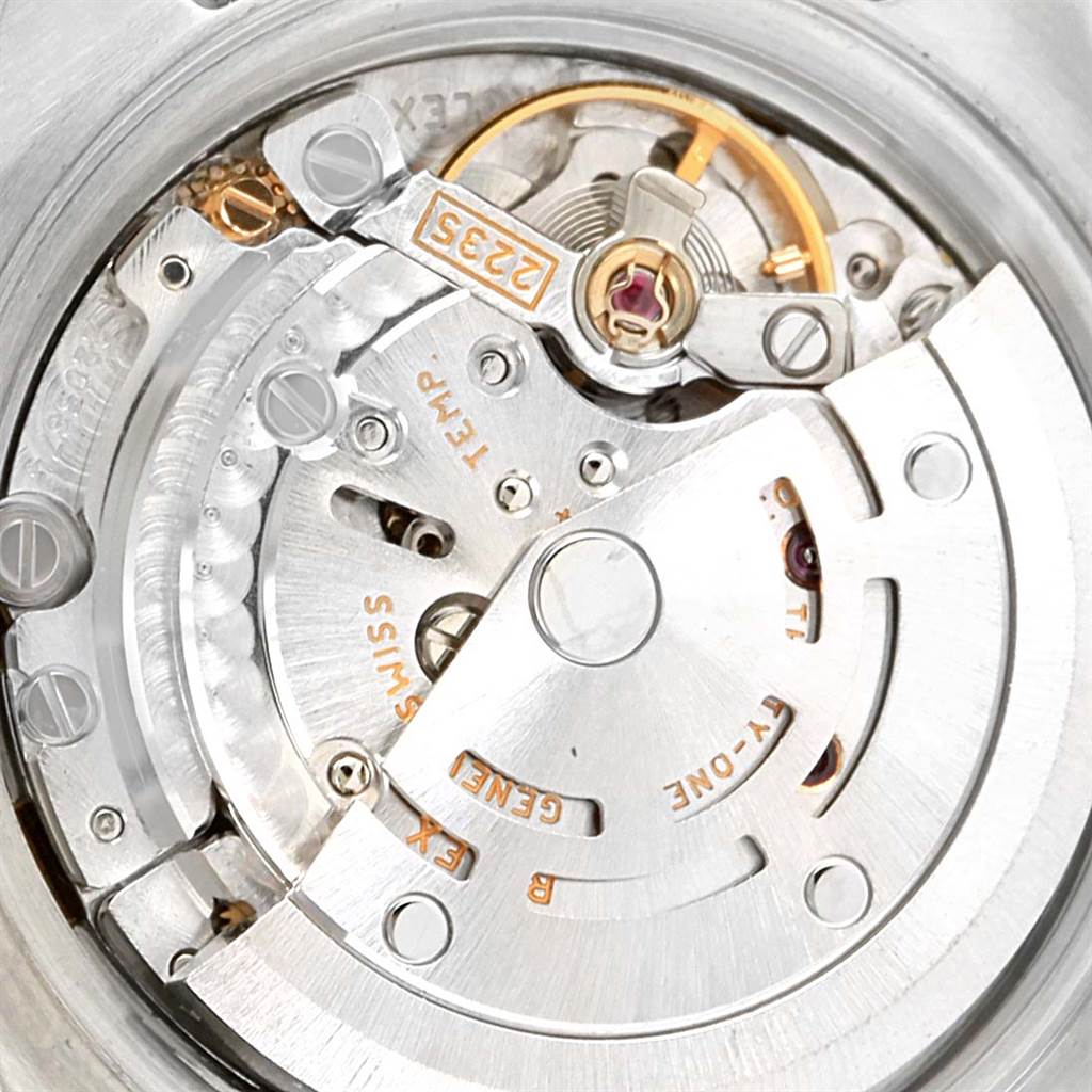 This image shows an internal view of the Rolex Datejust 179163 Women's Steel and Gold (two tone) Mother of Pearl Dial 179163 Women's Steel and Gold (two tone) Mother of Pearl Dial watch mechanism, highlighting the rotor and movement components.