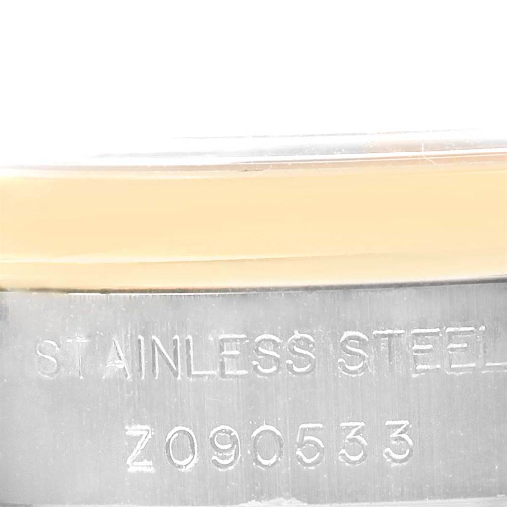 This image shows a close-up of the side of a Rolex Datejust 179163 Women's Steel and Gold (two tone) Mother of Pearl Dial 179163 Women's Steel and Gold (two tone) Mother of Pearl Dial watch, focusing on the stainless steel casing and serial number.