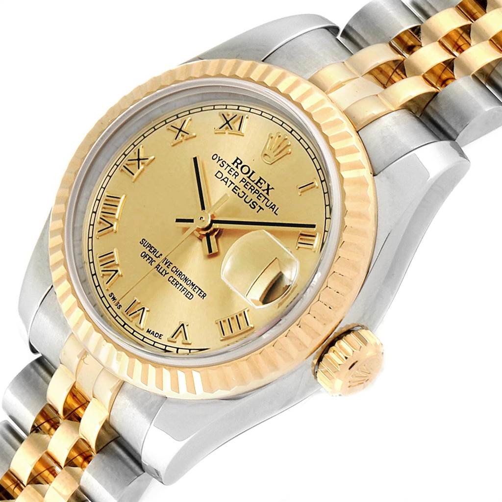 The image shows a close-up angled view of a Rolex Datejust 179173 Women's Steel and Gold (two tone) Champagne Dial 179173 Women's Steel and Gold (two tone) Champagne Dial watch, highlighting the dial, fluted bezel, crown, and part of the bracelet.