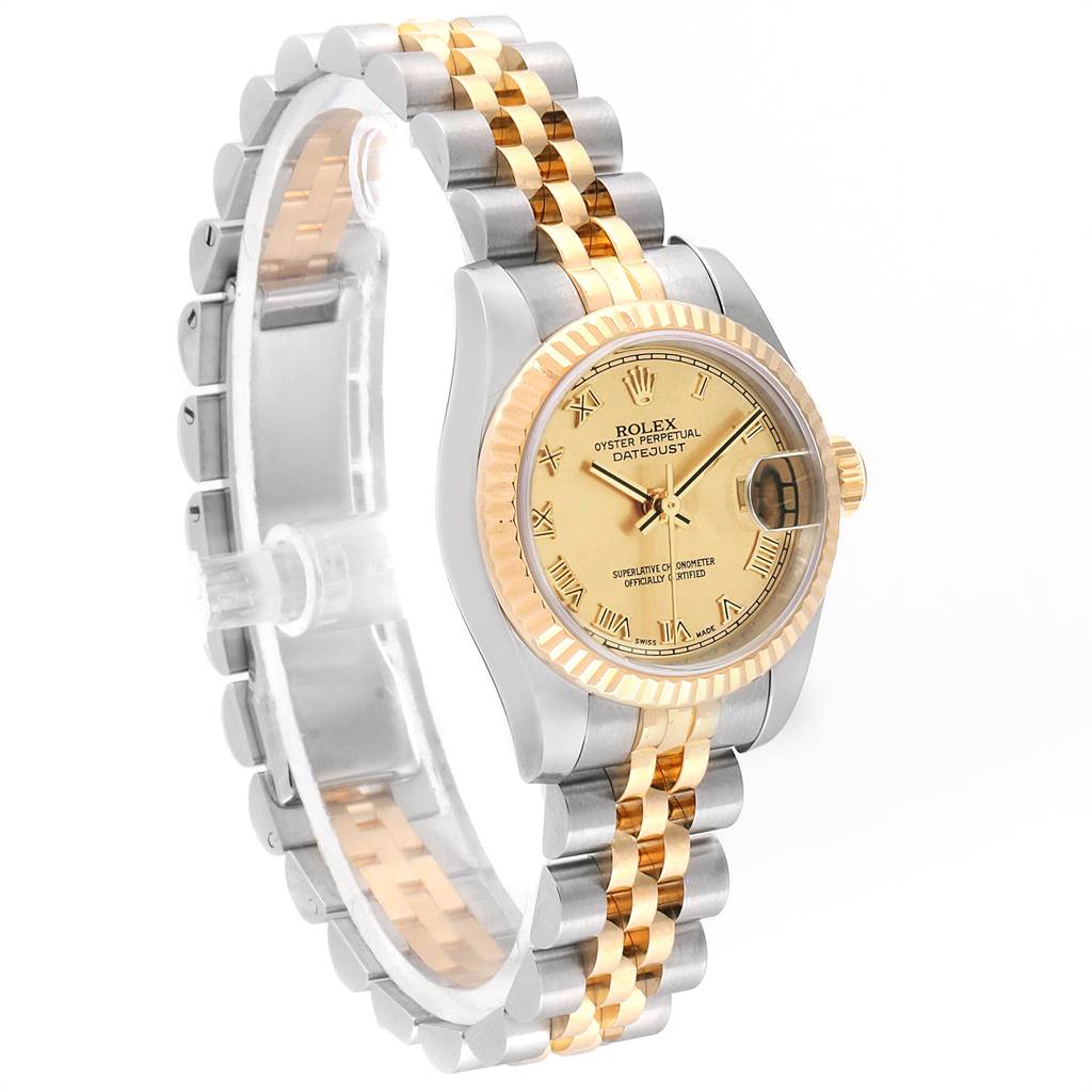 The image shows a side angle of a Rolex Datejust 179173 Women's Steel and Gold (two tone) Champagne Dial 179173 Women's Steel and Gold (two tone) Champagne Dial watch, highlighting its two-tone bracelet, gold dial, and fluted bezel.