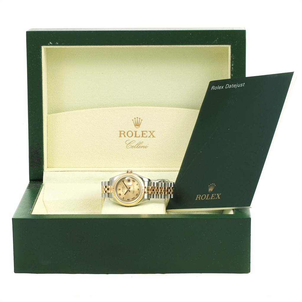 This image shows a Rolex Datejust 179173 Women's Steel and Gold (two tone) Champagne Dial 179173 Women's Steel and Gold (two tone) Champagne Dial watch and its booklet inside an open green presentation box.