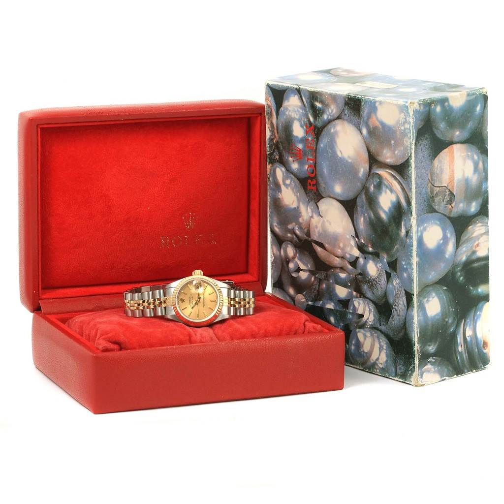 The image shows a Rolex Datejust 69173 Women
s Stainless Steel Champagne Dial 69173 Women
s Stainless Steel Champagne Dial watch in an open red case with the outer box displayed beside it.