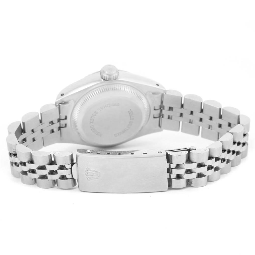 The image shows the back view of a Datejust Rolex watch, highlighting its bracelet and clasp.