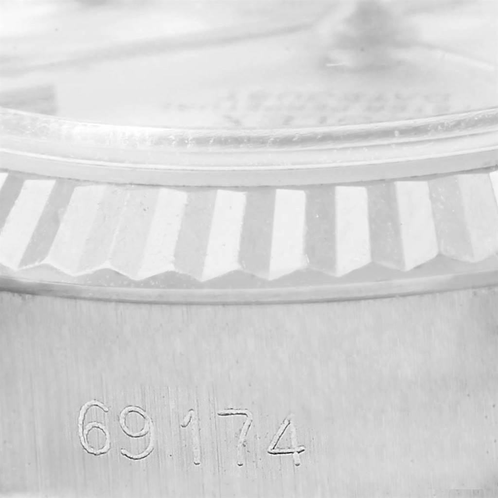 The image shows a close-up of the bezel and case side of a Rolex Datejust 69174 Women's Stainless Steel Silver Dial 69174 Women's Stainless Steel Silver Dial model, with the reference number 69174 visible.