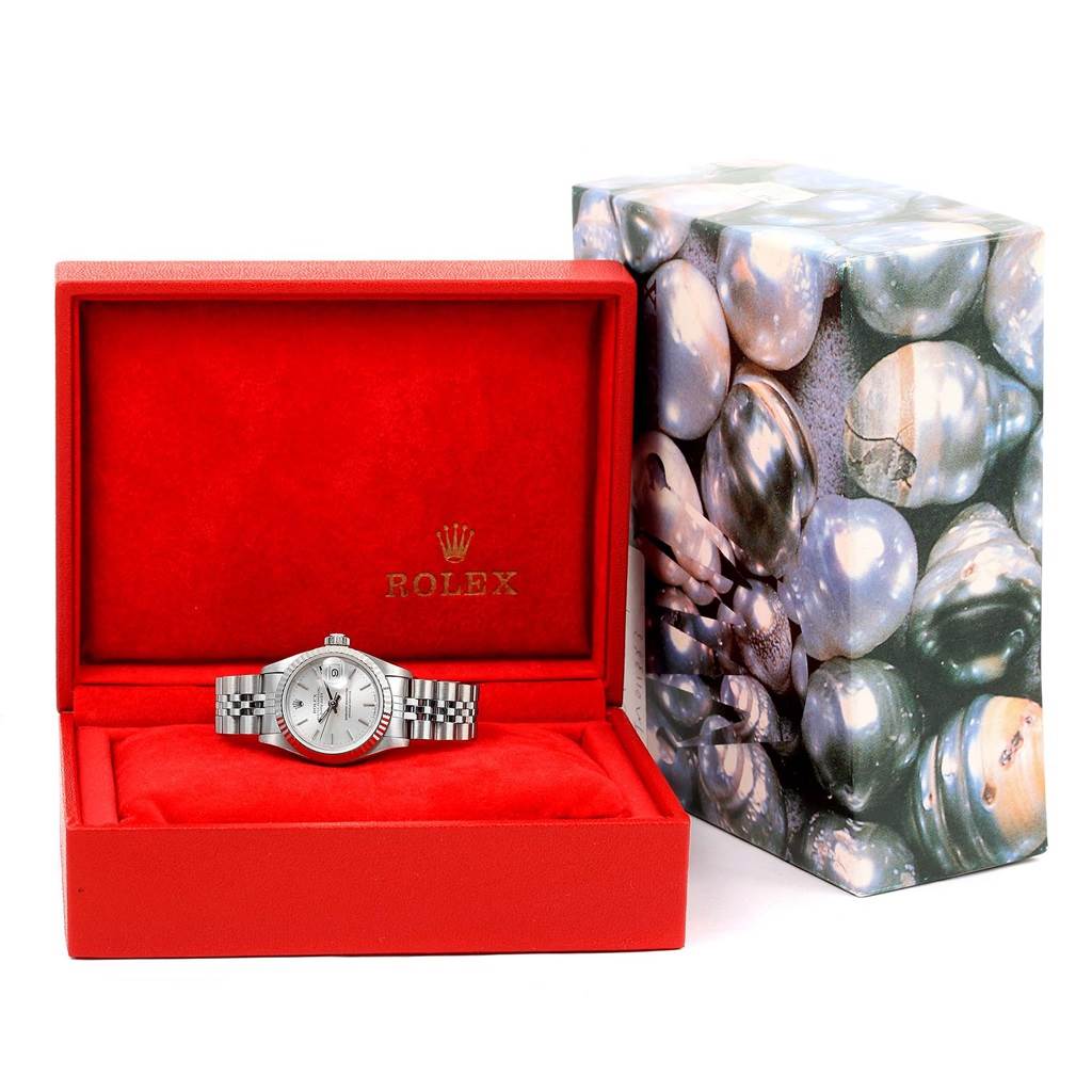 The Rolex Datejust 69174 Women's Stainless Steel Silver Dial 69174 Women's Stainless Steel Silver Dial watch is displayed frontally in an open red box with a decorative outer box beside it.
