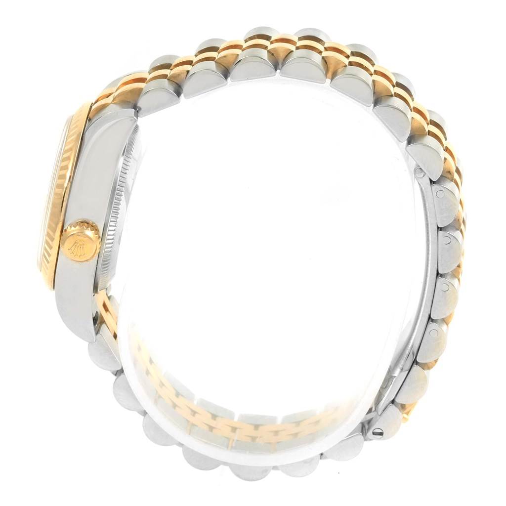 This image shows a side view of the Rolex Datejust 179173 Women's Steel and Gold (two tone) Mother of Pearl Dial 179173 Women's Steel and Gold (two tone) Mother of Pearl Dial watch, focusing on the two-tone bracelet and crown.