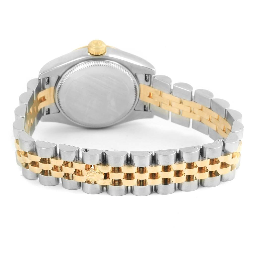 The image shows the back case and the two-tone bracelet of a Rolex Datejust 179173 Women's Steel and Gold (two tone) Mother of Pearl Dial 179173 Women's Steel and Gold (two tone) Mother of Pearl Dial watch.