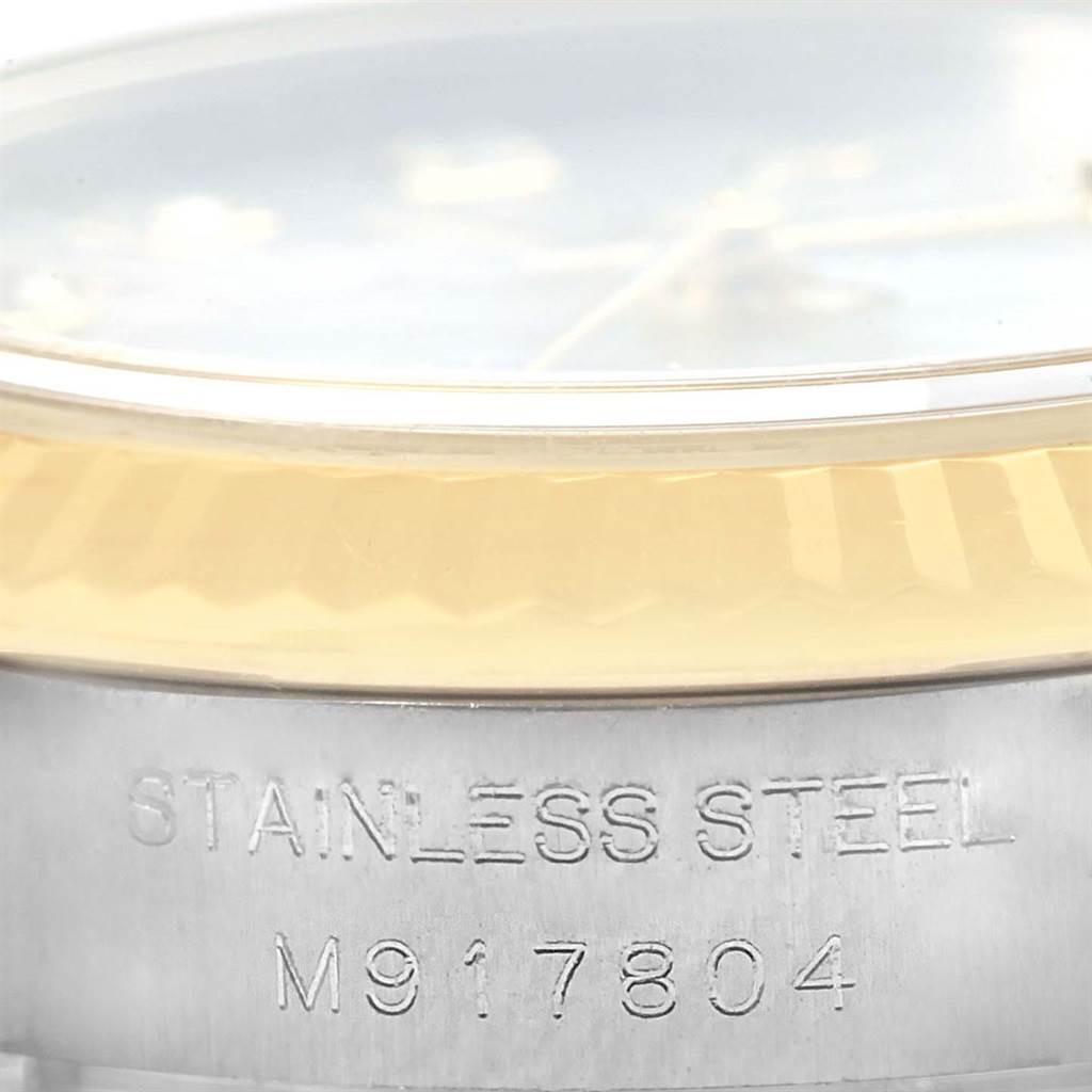 The image shows a close-up of the side of a Rolex Datejust 179173 Women's Steel and Gold (two tone) Mother of Pearl Dial 179173 Women's Steel and Gold (two tone) Mother of Pearl Dial watch, highlighting the stainless steel part with the serial number.