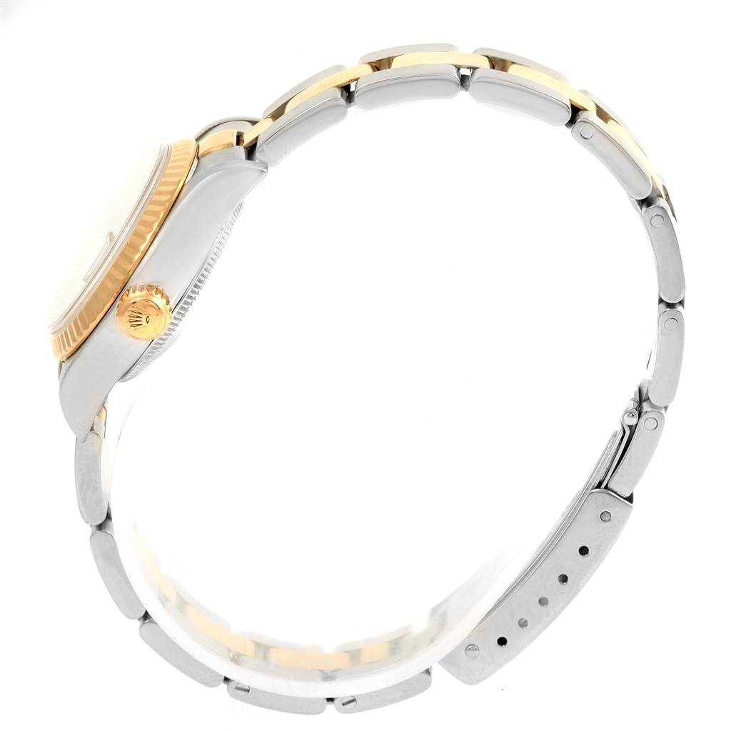 The image shows a side view of a Rolex Datejust 79173 Women's Steel and Gold (two tone) White Dial 79173 Women's Steel and Gold (two tone) White Dial watch, focusing on the case, crown, and metal bracelet.