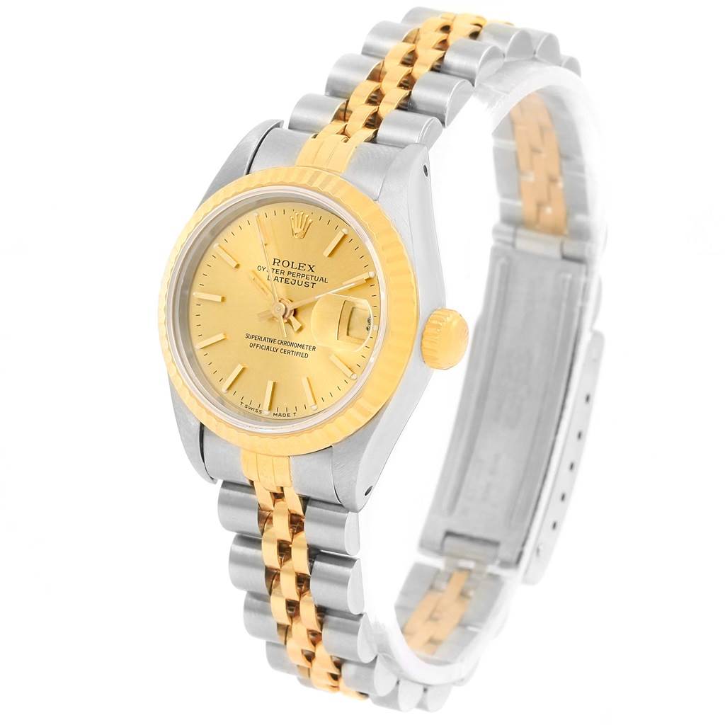 This Rolex Datejust 69173 Women's Stainless Steel Champagne Dial 69173 Women's Stainless Steel Champagne Dial watch is shown at an angled view, displaying its face, bezel, crown, and two-tone bracelet.