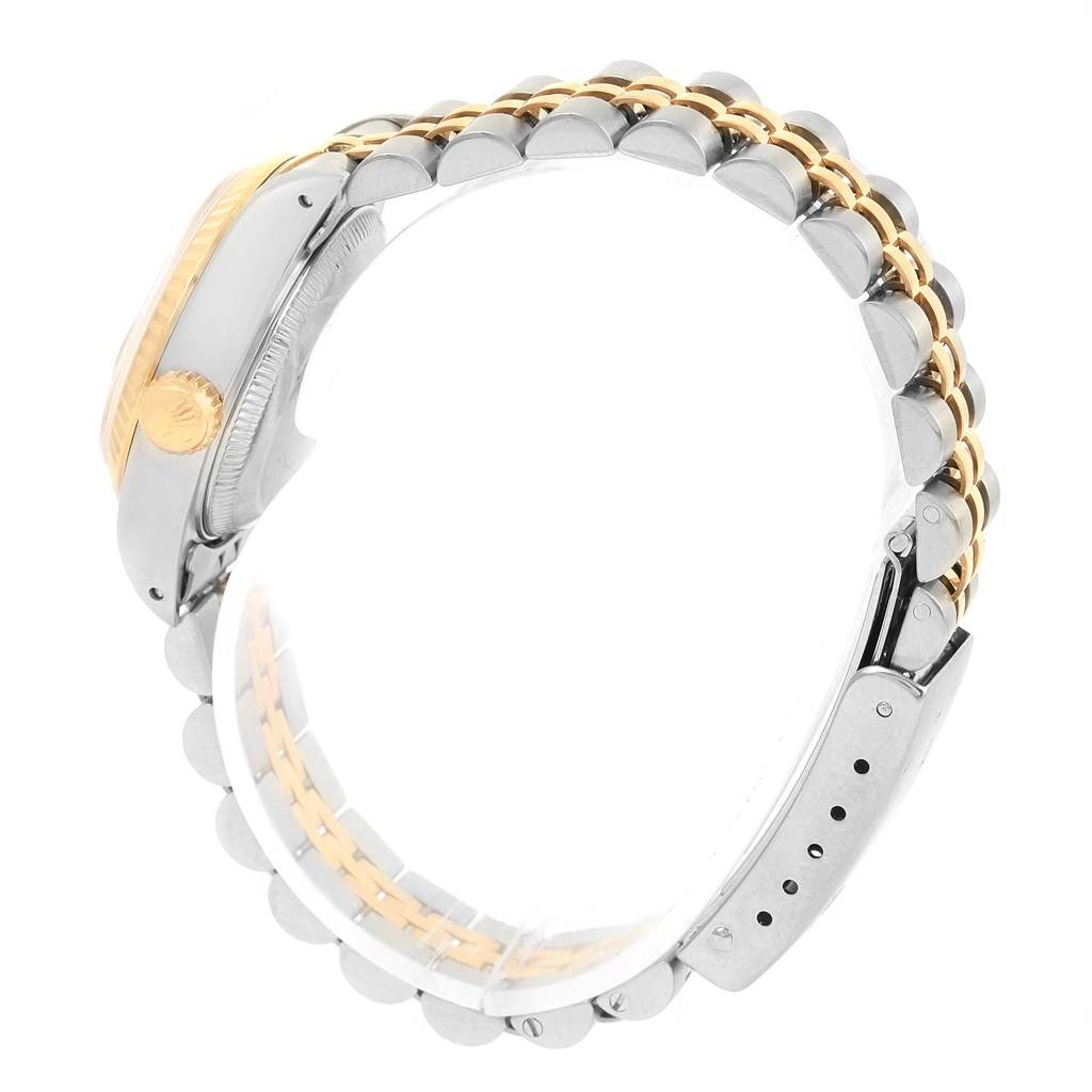 The image shows a side view of a Rolex Datejust 69173 Women's Stainless Steel Champagne Dial 69173 Women's Stainless Steel Champagne Dial watch, highlighting its two-tone bracelet and case with the crown visible.