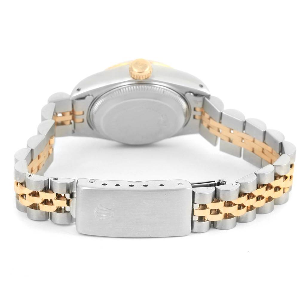 The image shows the back view of a Rolex Datejust 69173 Women's Stainless Steel Champagne Dial 69173 Women's Stainless Steel Champagne Dial watch, focusing on the case back and the gold and silver jubilee bracelet with the clasp.