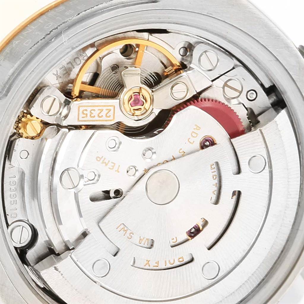 This image shows a close-up of the movement inside a Rolex Datejust 179173 Women's Steel and Gold (two tone) Black Dial 179173 Women's Steel and Gold (two tone) Black Dial watch, highlighting various mechanical parts.