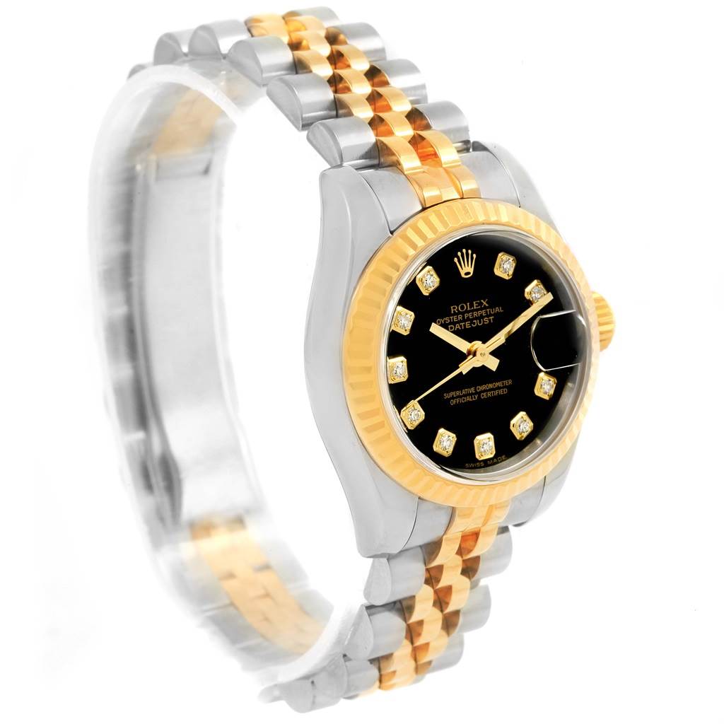 This image shows a Rolex Datejust 179173 Women's Steel and Gold (two tone) Black Dial 179173 Women's Steel and Gold (two tone) Black Dial watch from a side angle, showcasing its two-tone bracelet and black dial with diamond hour markers.