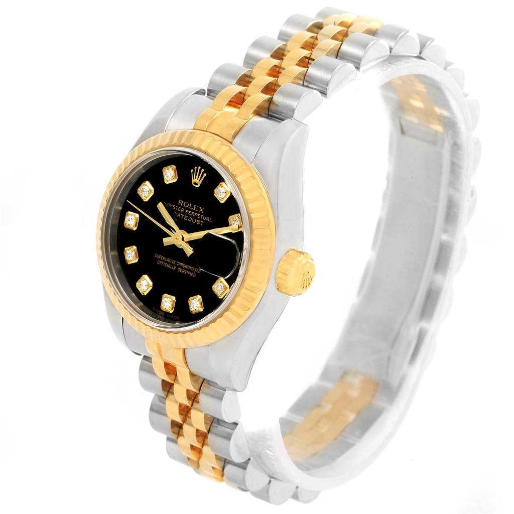 The image shows a Rolex Datejust 179173 Women's Steel and Gold (two tone) Black Dial 179173 Women's Steel and Gold (two tone) Black Dial watch at a slight angle, highlighting the bezel, crown, and two-tone bracelet.