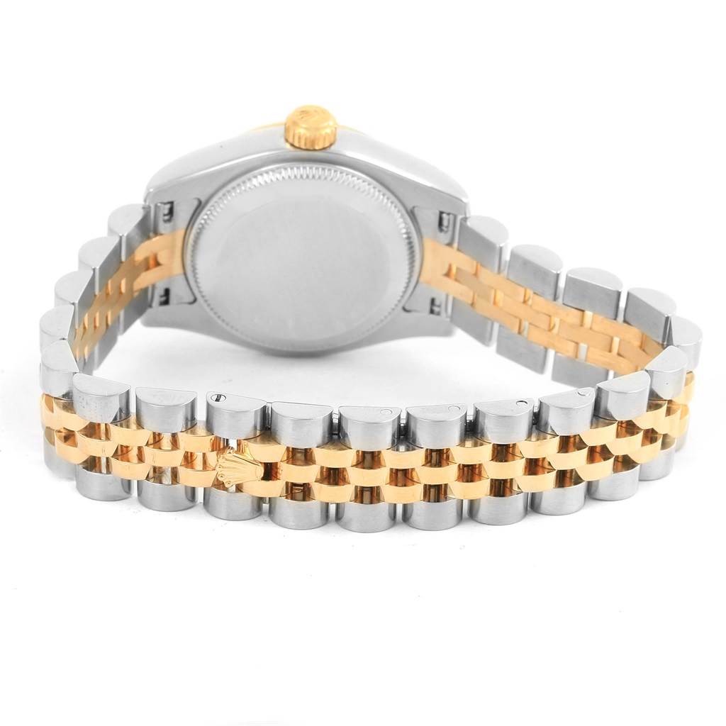 This image shows the back case and bracelet of a Rolex Datejust 179173 Women's Steel and Gold (two tone) Black Dial 179173 Women's Steel and Gold (two tone) Black Dial watch in a two-tone design.